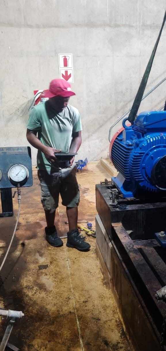 Technician inspecting motor components